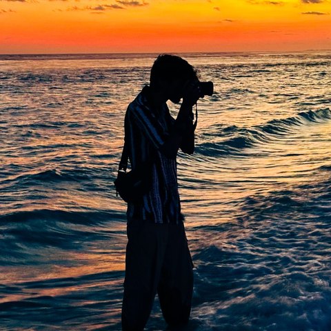 Kaushik photographing a sunset at the beach
