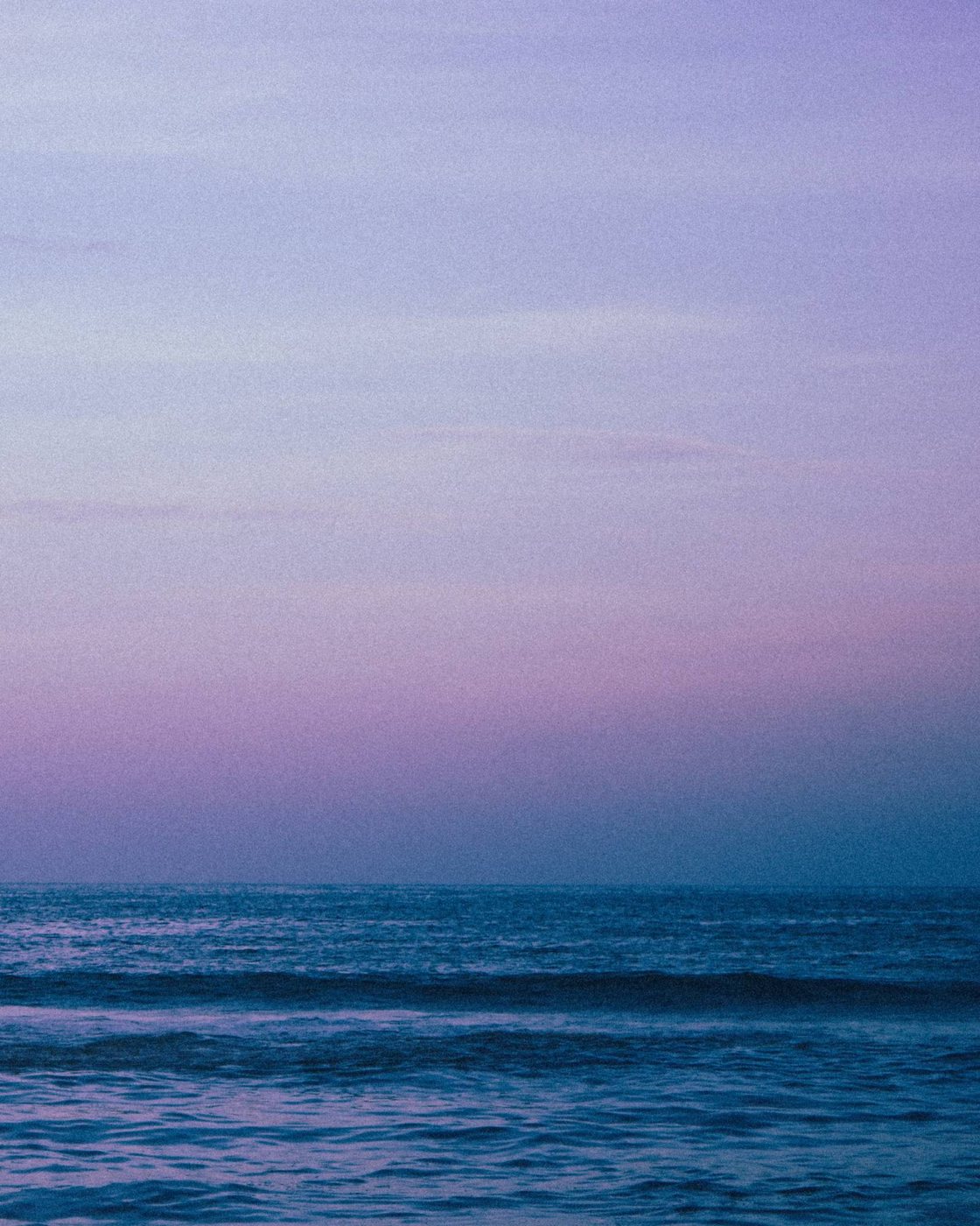 The sea at blue hour under a violet sky